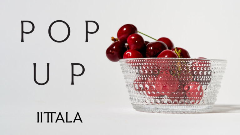 Kristallikulho täynnä tummanpunaisia kirsikoita, vasemmalla suuret tekstit POP UP ITALIA.
